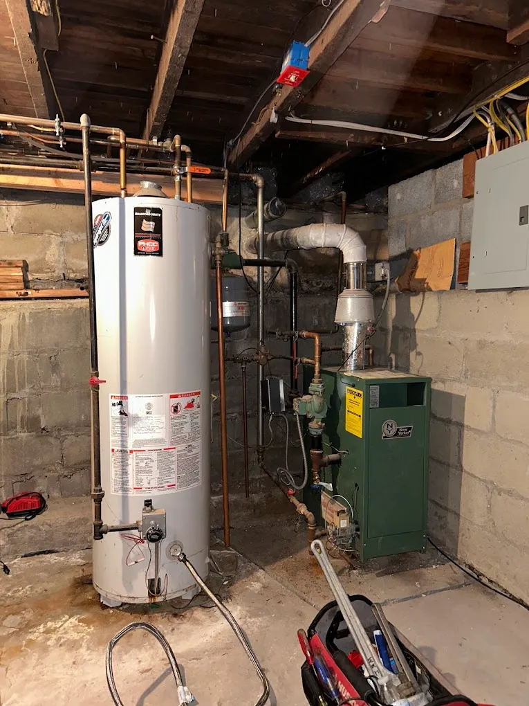 A gas water heater installed in a room