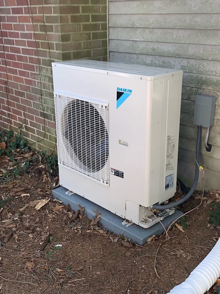 Air conditioning unit located outside a home